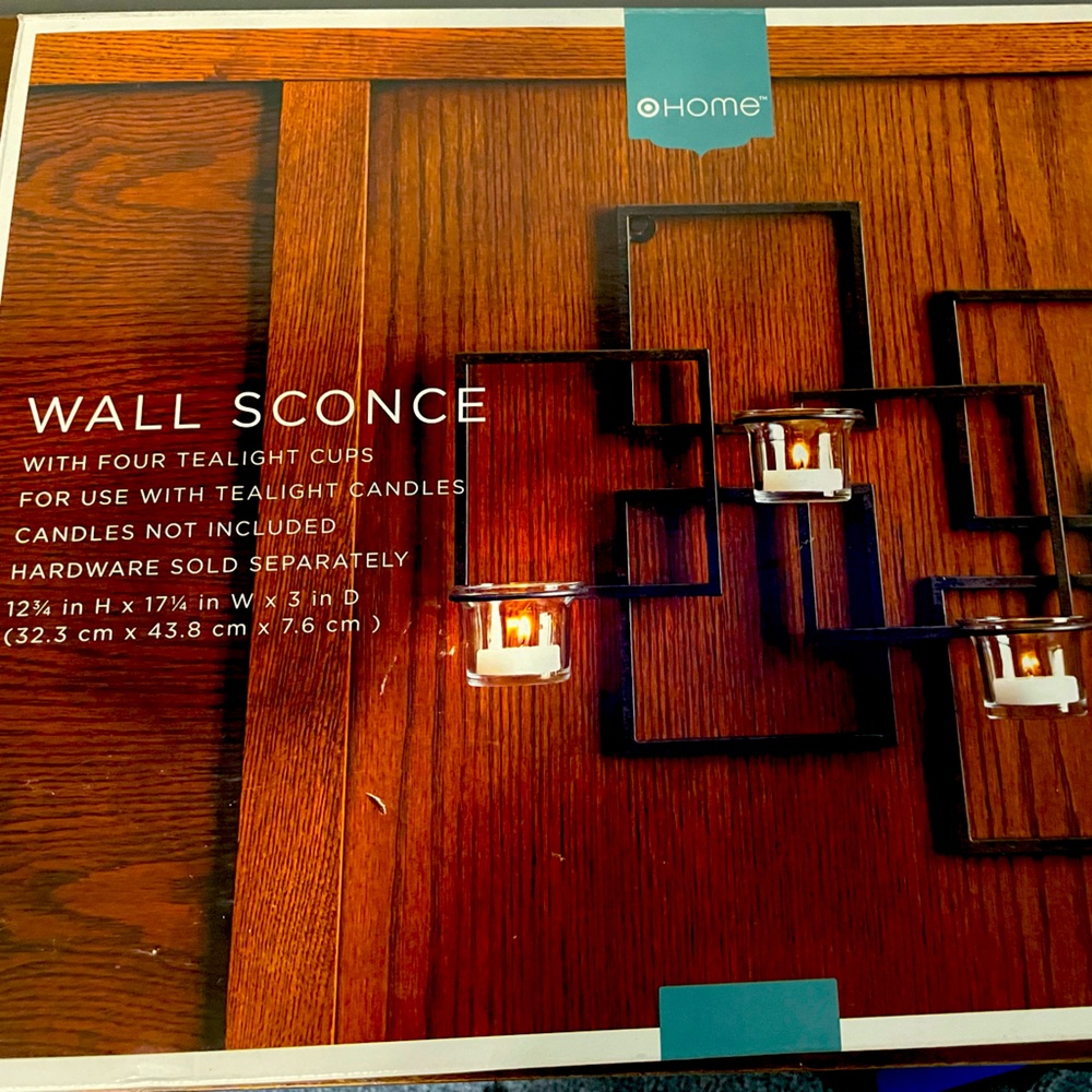Wall sconce. With 4 tea light cups for use with tealight candles.